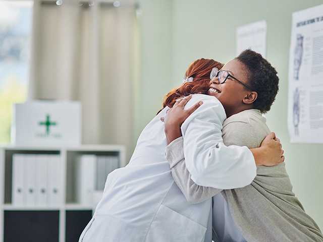 Doctor hugging their patient